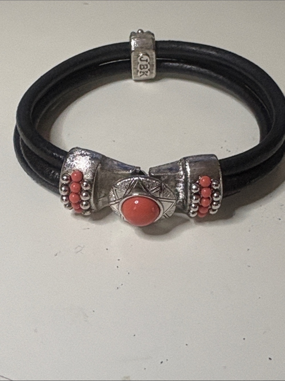 Black Leather Bracelet with Coral Accent and Silver-Tone Detailing